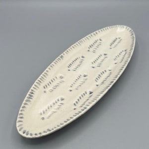 Studio Pottery Embossed Unique feather Shaped Plate in delicate color way.