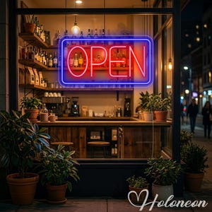 May include: A rectangular neon sign with the word OPEN in red letters surrounded by a blue border, mounted in a window above a wooden bar counter with shelves of bottles, coffee equipment, and several potted green plants in terracotta pots.