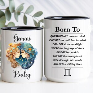 May include: Two white ceramic mugs with black rims and handles. One mug features a Gemini zodiac illustration with two faces and the name Hailey. The other mug displays the text Born To, followed by a list of traits and the Gemini zodiac symbol.