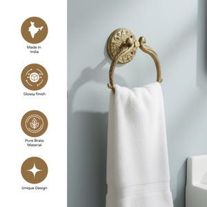 May include: A brass towel ring with a decorative floral design and a glossy finish. The ring is holding a white towel. The text on the image says "Made in India", "Glossy finish", "Pure Brass Material", and "Unique Design".