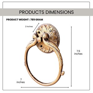 May include: Ornate brass towel ring with a floral and bird design. The ring is 7 inches in diameter and 7.5 inches tall. The product weight is 789 grams. The ring has a 2-inch diameter base.