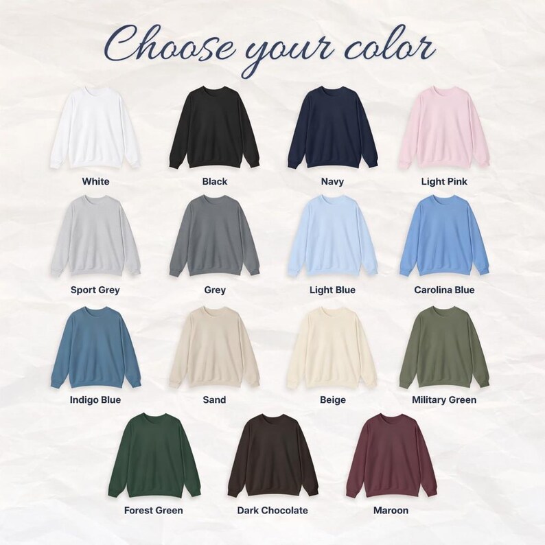 May include: A selection of crewneck sweatshirts in various colors, including white, black, navy, and light pink. The image displays the text "Choose your color" at the top, with color names like "Sport Grey", "Grey", and "Indigo Blue" below each sweatshirt.