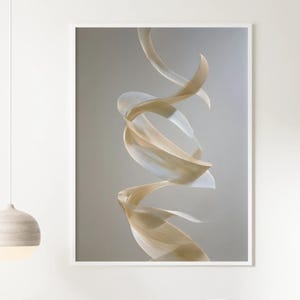 May include: Abstract art print featuring flowing, ribbon-like forms in shades of beige and white against a neutral background. The artwork is framed in a white border, creating a modern and minimalist aesthetic. The print is displayed in a bedroom setting.