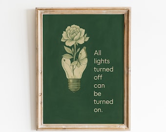 May include: Framed art print featuring a green background with a lightbulb design. Inside the lightbulb is a flower and a butterfly. The text reads "All lights turned off can be turned on."