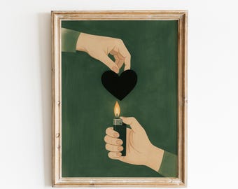 May include: Framed art print featuring a black heart above a lit lighter. The artwork depicts two sets of hands, one holding the heart and the other holding the lighter with a flame. The background is a dark green color.