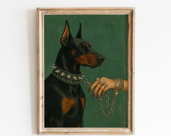 May include: A framed painting of a black and tan Doberman Pinscher wearing a silver spiked collar. A hand with long red nails and multiple gold rings holds a thick silver chain leash attached to the collar against a solid dark green background.