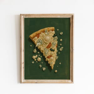 May include: A framed artwork depicting a pizza slice embellished with pearls, diamonds, and gems. The pizza is set against a dark green backdrop. The frame is a light brown colour.