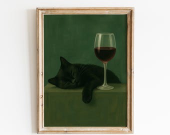 May include: A framed print depicting a black cat asleep beside a glass of red wine. The cat is resting on a green surface, set against a dark green backdrop. The artwork has a vintage style and aesthetic.