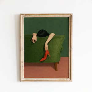 The image is a framed painting depicting a woman resting her head on a green couch, with her hand resting on a red shoe.