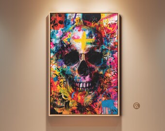 Puede incluir: Una obra de arte enmarcada que presenta una calavera vibrante al estilo grafiti. La calavera está representada en una explosión de colores, incluyendo rosa, amarillo, azul y verde, con una cruz amarilla en la frente. La obra se exhibe en una pared de tono neutro.