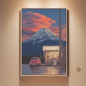 May include: Framed artwork depicting a serene landscape with a snow-capped mountain under a vibrant sunset. A red car is parked near a small gas station. The sky is filled with orange and pink clouds, creating a tranquil scene.