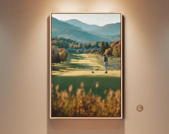 Puede incluir: Impresión artística enmarcada de un campo de golf con un golfista preparándose para golpear. La obra presenta una calle verde, árboles con follaje otoñal y montañas distantes bajo un cielo azul. El marco es de color madera clara.