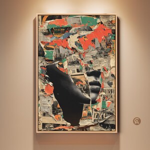 May include: Abstract mixed media artwork in a wooden frame. The artwork features torn paper with areas of black, orange, and green. The composition includes fragments of text and a large black shape. The artwork is displayed on a beige wall.