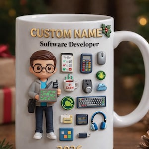 May include: White ceramic mug with a custom name and the text "Software Developer." The mug features a cartoon figure, a calculator, a mouse, a keyboard, and other tech-related icons. The year 2026 is also displayed.