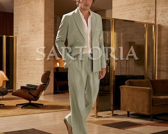 Eleganza parigina senza sforzo: l'abito doppiopetto in lino verde salvia per le serate estive e le gallerie del gentiluomo moderno.