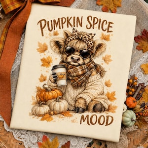 May include: A rectangular sign featuring a graphic of a fluffy highland cow wearing a leopard print headband, sunglasses, and a plaid scarf. The cow holds a coffee cup. The text reads PUMPKIN SPICE MOOD, surrounded by orange autumn leaves and pumpkins.