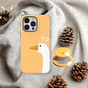 May include: A trio of ceramic mugs with a speckled, matte finish in cream, light grey, and dark grey. Each mug features a simple, minimalist design, ideal for tea or coffee.