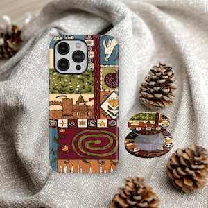 May include: A patterned phone case and matching phone grip. The design includes illustrations of a castle, flowers, and a snake. The case has a multi-camera lens cutout. The phone grip is open and closed.