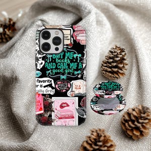 May include: Black phone case with a collage design featuring the text "Buy me books and call me a good girl." The case includes various graphics like books, bows, and a gun. A matching pop socket is also visible.
