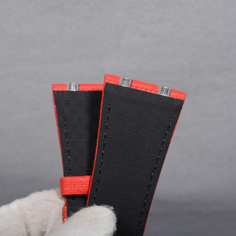 May include: A white ceramic mug with a black handle and the text "But First, Coffee" in a handwritten style. The mug is on a white surface. The mug is approximately 4 inches tall.