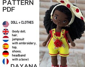May include: A crocheted doll wearing a yellow jumpsuit with red accents and a matching headband with a bow. The doll has black hair and red shoes. The image includes the text "CROCHET PATTERN PDF" and "DAYANA".