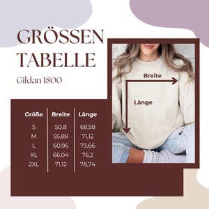 May include: A size chart for Gildan 1800 sweatshirts, with measurements in centimeters. The chart includes sizes S, M, L, XL, and 2XL, with corresponding width and length measurements. The image also shows a person wearing a sweatshirt, with arrows indicating width and length.