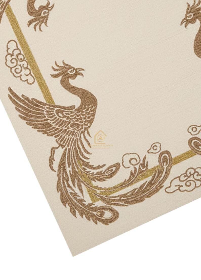 May include: Cream-coloured textile featuring a detailed brown phoenix design. The phoenix is depicted with outstretched wings and flowing tail feathers, surrounded by stylised cloud motifs and gold accents. The design is on a textured surface.