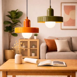 May include: A white ceramic mug with a black handle and the text "But First, Coffee" in a black, handwritten-style font. The mug is on a white surface.