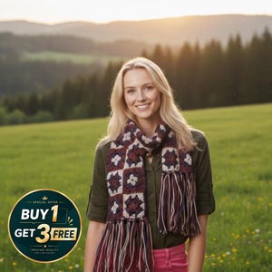 May include: A crochet scarf featuring a repeating granny square pattern in shades of dark red, cream, and dark blue. The scarf is finished with long, multi-colored fringe tassels at both ends, incorporating the same color palette of red, cream, and blue.