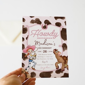 May include: A rectangular party invitation card featuring a brown and white cow print background. The text reads Howdy, Madison's 3rd Roundup, Jan 26, 3pm, 2584 Mission Street, Building C, 2 Unit 314, San Francisco, CA 94110, Rsvp to Sophia at 123.456.7890.