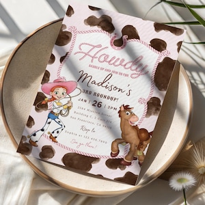 May include: A rectangular party invitation card with a brown and white cow print background. The text reads Howdy, Saddle up and join us for Madison's 3rd Roundup, Jan 26, 3pm, 2584 Mission Street, San Francisco, CA 94110, Rsvp to Sophia at 123.456.7890, See ya there!