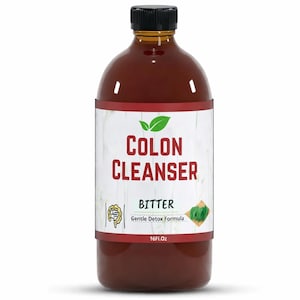 May include: A brown glass bottle with a black cap and a white label. The label reads "COLON CLEANSER" in red letters with green leaves above the text. Below the text, it says "BITTER Gentle Detox Formula" and "16Fl.Oz."
