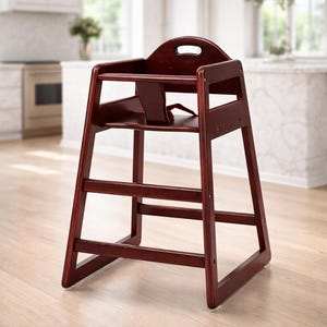 May include: A wooden high chair in a rich, dark cherry finish. The chair features a seat, footrest, and a safety strap. The back has a handle for easy transport. The high chair is designed for infants and toddlers.
