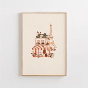 Può includere: Una stampa artistica incorniciata con un disegno al tratto di un caffè parigino con tenda a righe rosse e bianche, piante in vaso e posti a sedere all'aperto, su sfondo crema con la sagoma della Torre Eiffel sullo sfondo.