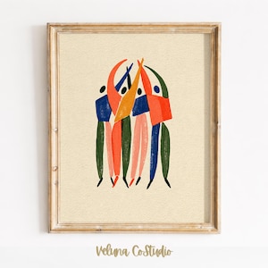 May include: A framed art print featuring a group of abstract figures with raised arms in a circle. The figures are rendered in solid blocks of orange, blue, pink, and dark green against a textured cream background. The text Veluna CoStudio is below.
