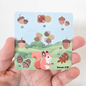 May include: A square card featuring a cartoon squirrel in a green landscape with various nuts and seeds illustrated above it. Each item is marked with a £2 symbol, and the text in the bottom right corner reads Saves £18. The design uses soft pastel colours.
