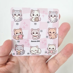 May include: A square sticker sheet featuring nine cartoon cat illustrations on a light pink and white checkered background. Each cat is paired with a small circle containing the text £2, and the centre bottom includes the text Saves £18.