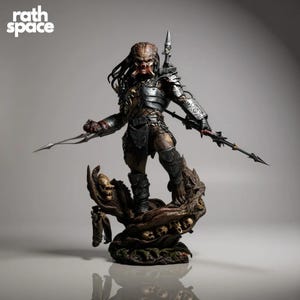 May include: A detailed Predator action figure, standing on a sculpted base with skulls. The figure is clad in metallic armour and holds bladed weapons. The figure has dreadlocks and a detailed face. The Rath Space logo is in the top left corner.