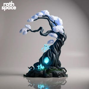 May include: A detailed sculpture of a stylized tree with a dark trunk and white, cloud-like foliage. The tree features glowing blue accents, including a central portal and several small, ethereal figures. The "rath space" logo is in the upper left.