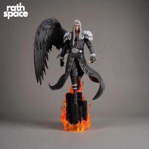 May include: A detailed figurine of a character with long silver hair, black wings, and a black outfit, holding a sword. The figure stands on a black platform with orange flames. The text "rath space" is in the upper left corner.