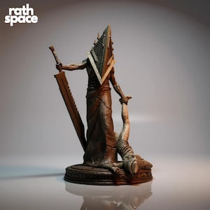 May include: A detailed statue of a figure with a pyramid-shaped head, holding a large sword and a person's leg. The figure is dark brown and stands on a round base. The text "rath space" is in the upper left corner.