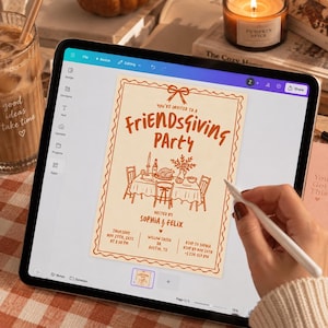 May include: A digital tablet displaying a Friendsgiving party invitation template with orange text and line art on a cream background. The design features a table setting, a bow at the top, and details for a party hosted by Sophia and Felix.
