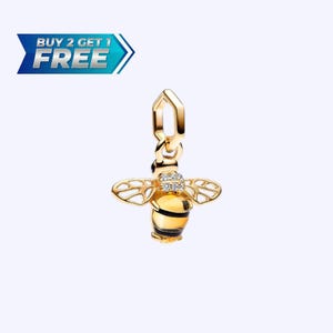 May include: A gold-colored bee charm with a yellow body and black stripes. The bee has openwork wings and a small cluster of clear stones on its head. The charm is suspended from a gold bail. Text in the image reads "BUY 2 GET 1 FREE".