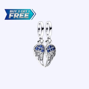 May include: Two silver charm pendants with a wing design. Each wing is decorated with blue and clear gemstones. The image includes a blue and white banner that reads "BUY 2 GET 1 FREE".