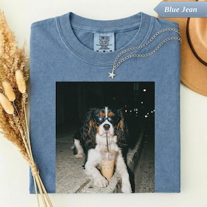 Blue Jean comfort colors t-shirt with a dog wearing sunglasses drinking a latte.