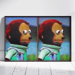 May include: A framed print featuring a meme of a monkey with a concerned expression. The monkey has red hair, a tan face, and is wearing a green shirt. The background has blue and green hues.