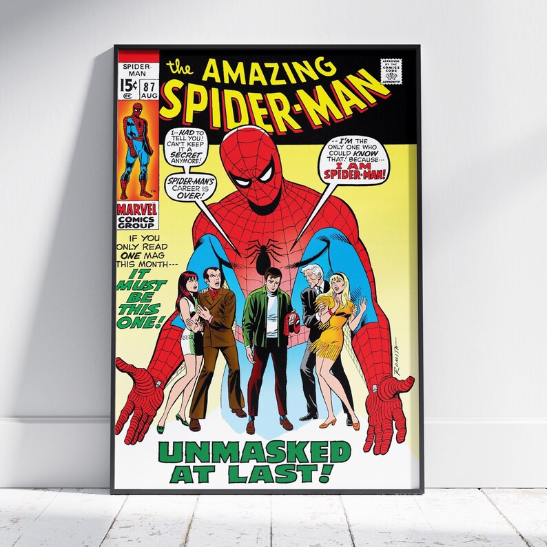 May include: A framed comic book cover of "The Amazing Spider-Man" #87. The cover features Spider-Man in a red and blue suit, with the text "Unmasked at Last!" and other characters. The comic is from Marvel Comics Group.
