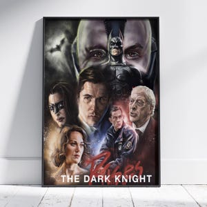 May include: A vertical film poster for The Dark Knight featuring a collage of characters including Batman, Bane, and other cast members. The artwork uses a dark colour palette with red accents and the text THE DARK KNIGHT printed at the bottom.