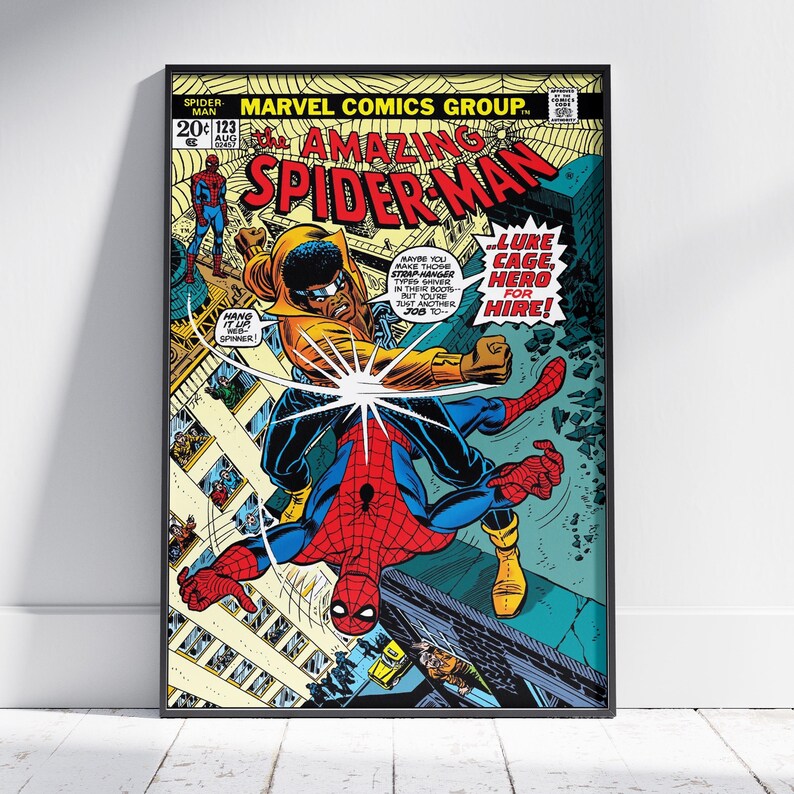 May include: A framed comic book cover of The Amazing Spider-Man, issue 123. The artwork features Spider-Man in a dynamic pose, battling a character in a yellow hooded outfit. Text includes "Lure Cage, Hero for Hire!" and "Marvel Comics Group."