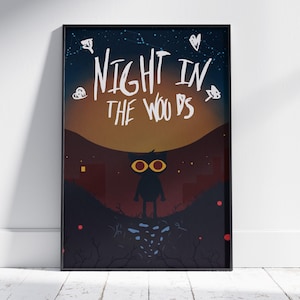 May include: Framed art print with the text "NIGHT IN THE WOODS" in white. It shows a silhouette of a character with yellow eyes against a night scene with a starry sky and a dark landscape.